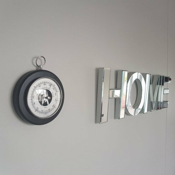 wall hung black and chrome barometer